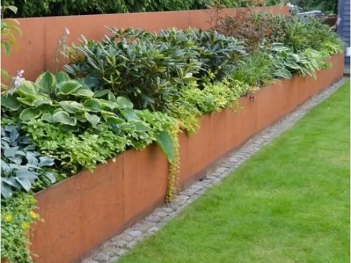Individual steel retaining wall panels ready for DIY garden installation.