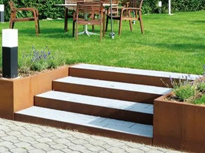 Preparing a pile holes for heavy-duty metal retaining walls on a slope.