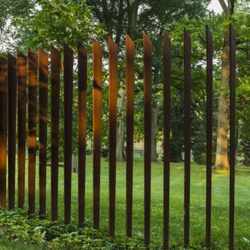 corten fence palings that sway in the wind