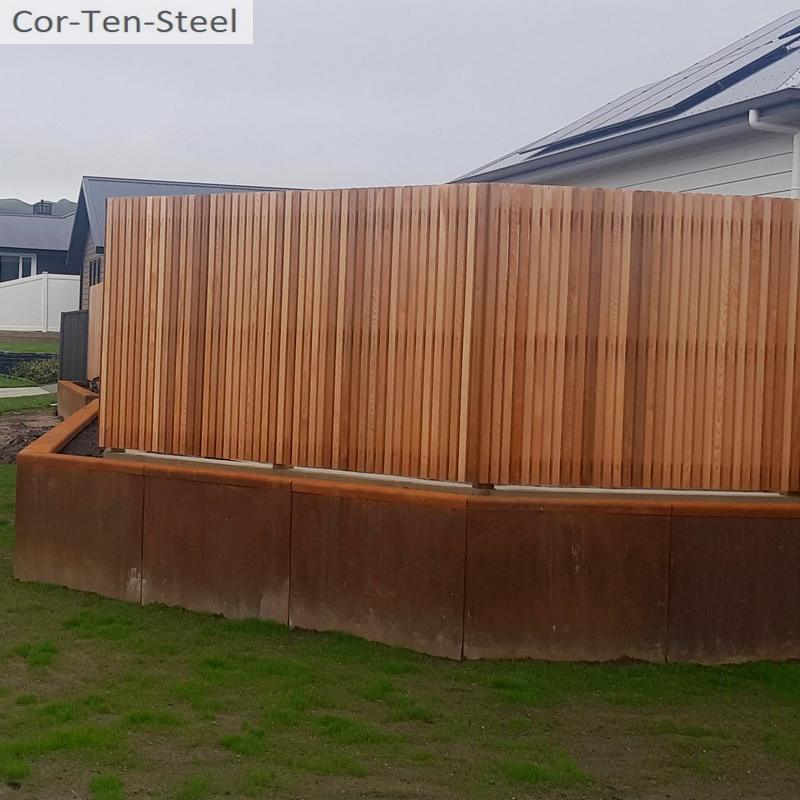 corten retaining wall with fence