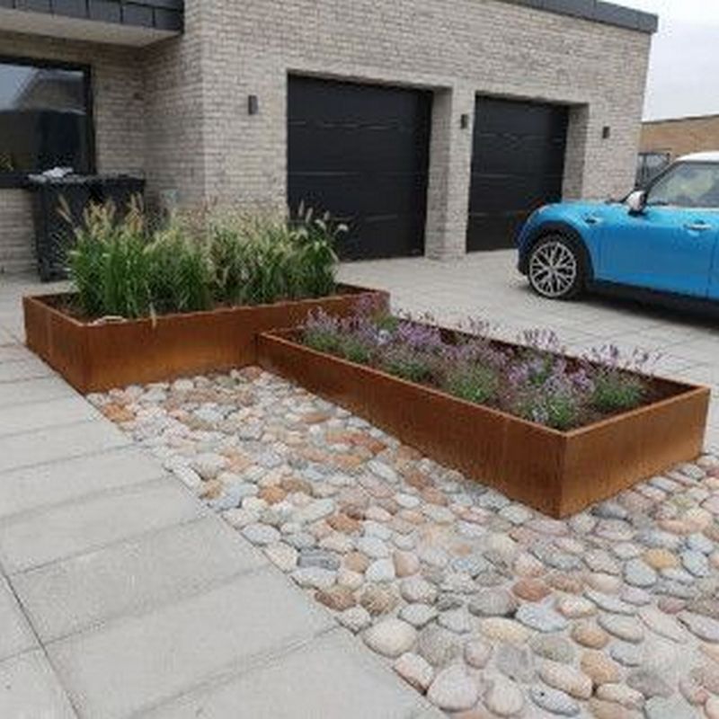 corten planters in driveway