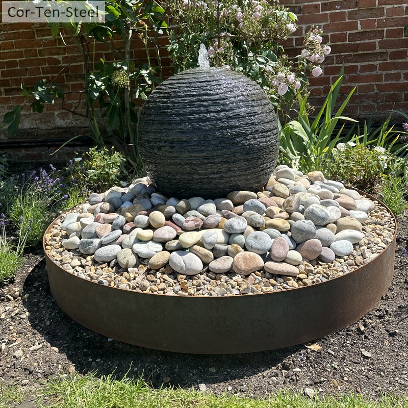 corten ring with water feature